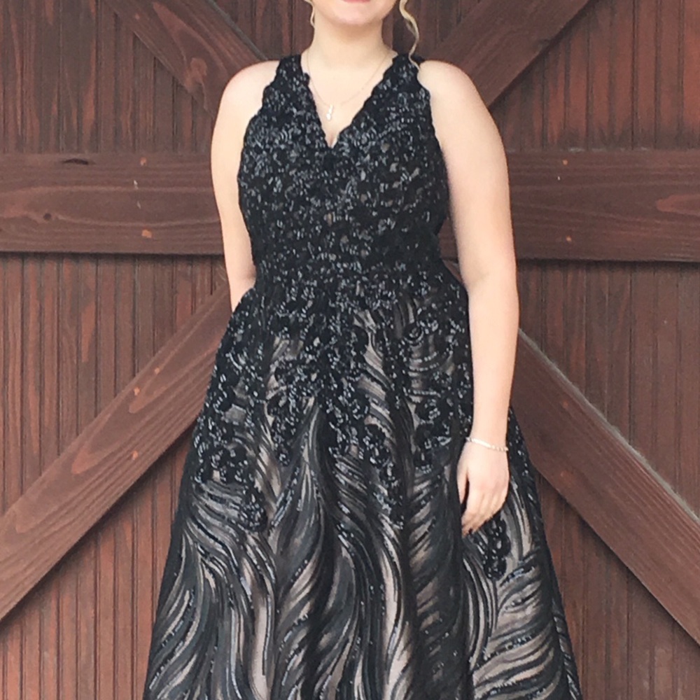 Black sequined prom dress. Style #: JVN 60641